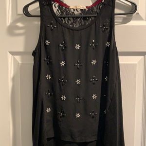 NWOT cute tank with lace detail flowy at bottom.